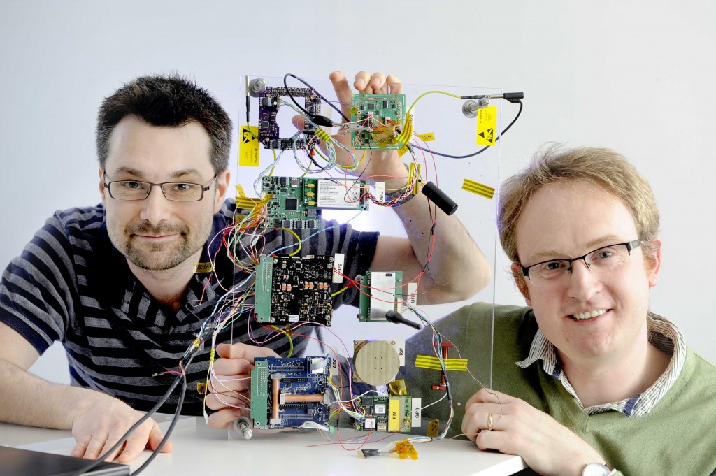Bright Ascension company, Edinburgh, 14/03/2017: Bright Ascension founder director Peter Mendham (correct, bottom), with technical director / software engineer Mark McCram and a satellite launch control board. Photography for Cooperative Development Scotland / Scottish Enterprise from:  Colin Hattersley Photography - colinhattersley@btinternet.com - www.colinhattersley.com - 07974 957 388