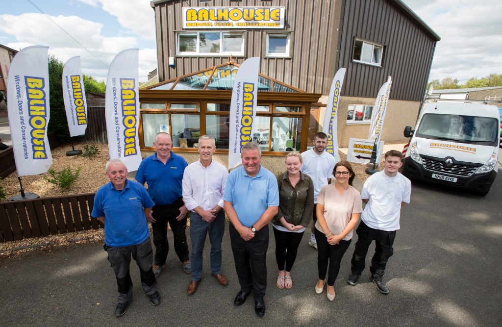 Employees and directors at Balhousie Glazing in Perth  Pictured Directors in centre Drew Hay (on left) with Malcolm Sweeney (on right) Taken 16-07-18