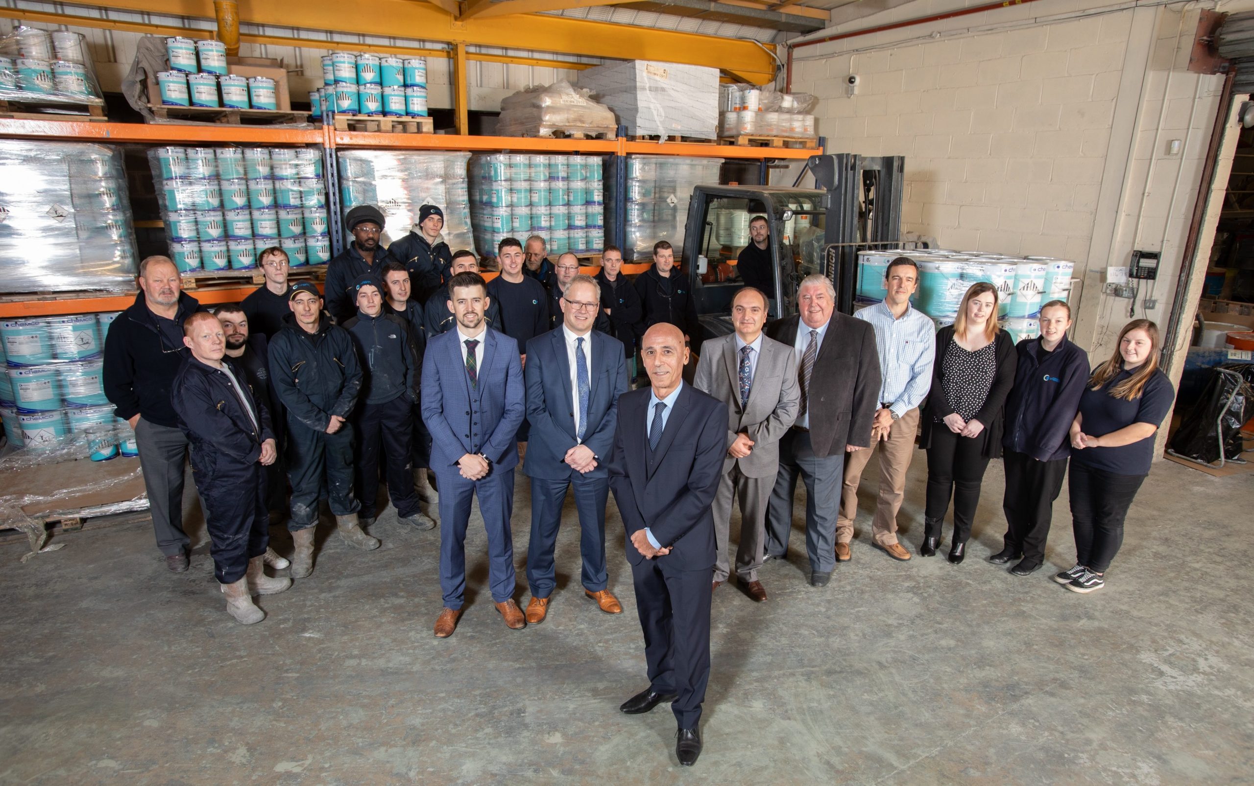 Chemco International, Coatbridge Image shows MD, Mansoor Khorasani (centre front) with colleagues at their Scottish manufacturing plant. 