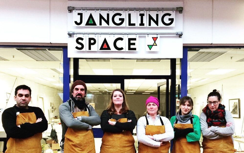 jangling space members standing in front of shop