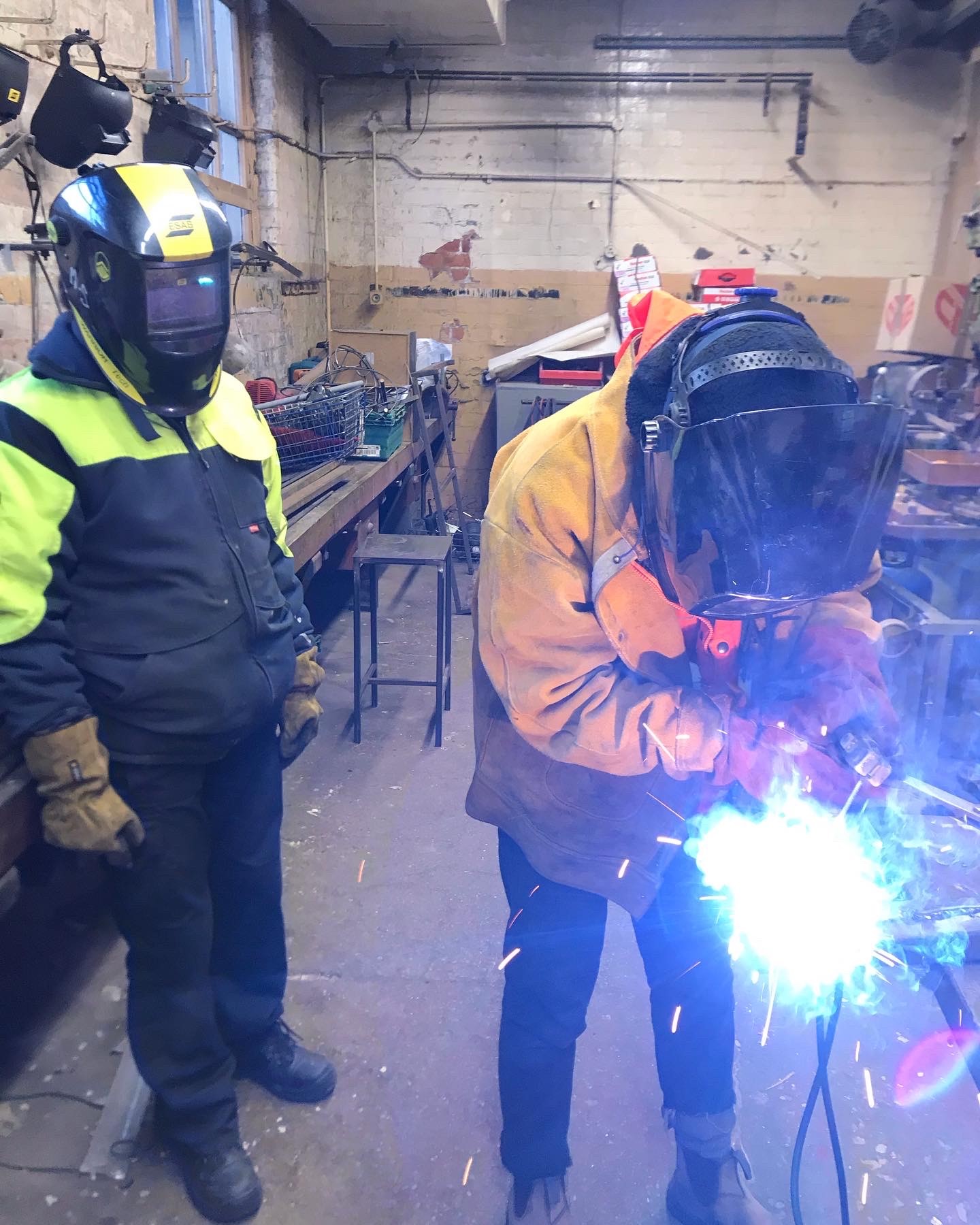 2 welders working in workshop